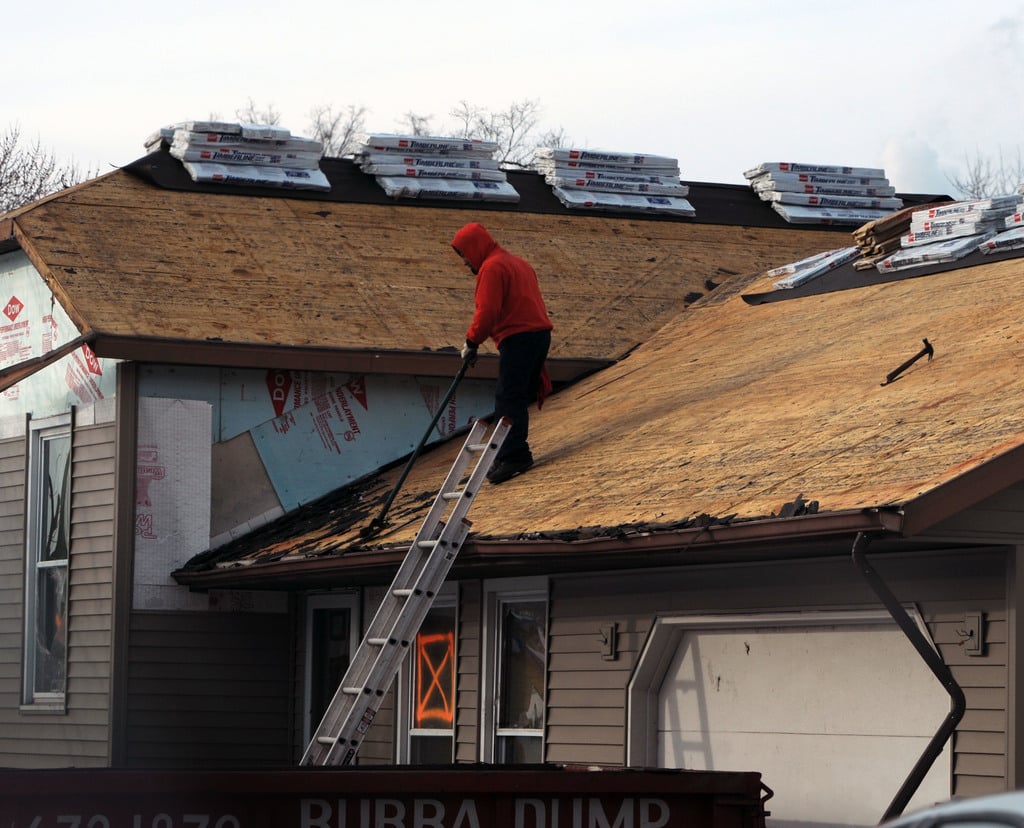Man preparing roof for solar panels installation